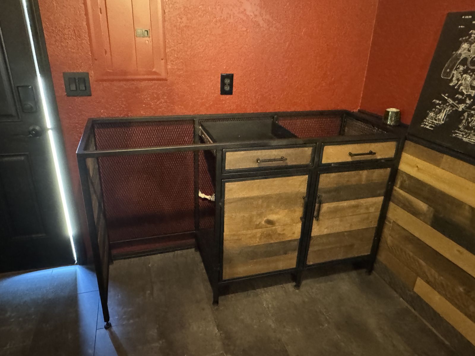 Base installed; reclaimed-wood drawer and door fronts going in.
