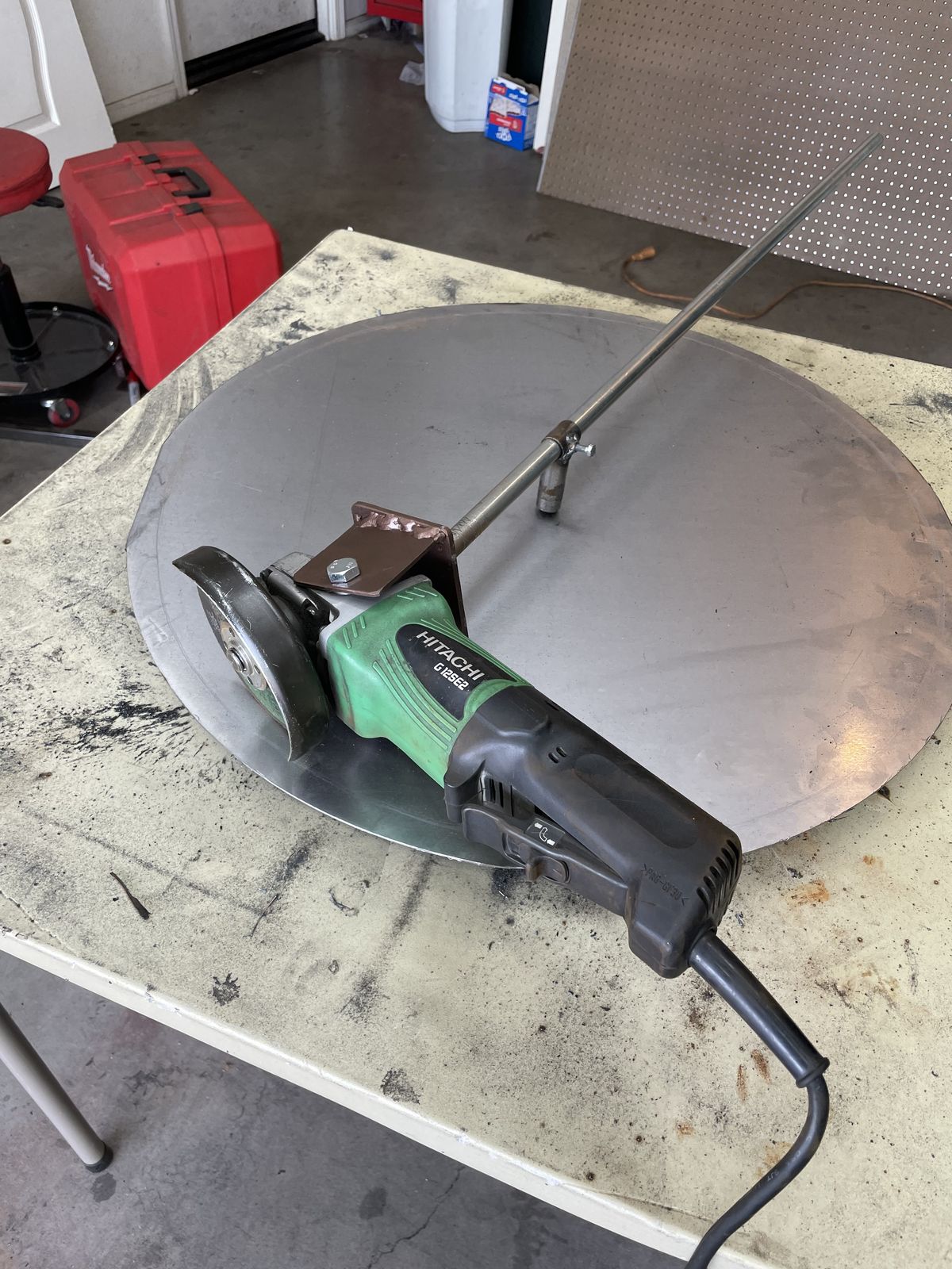 Cutting a steel disc for the clock face.